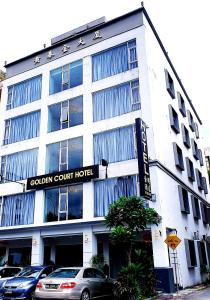 a white building with a sign that reads golden court hotel at Golden Court Hotel - Tun Abdul Razak in Johor Bahru