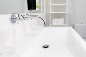 Un baño de Casas do Teatro