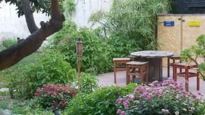 Vonkajšia záhrada v ubytovaní Urban Oasis Hostel
