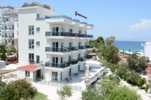 an aerial view of a hotel with the ocean in the background at Summer Gate Hotel in Ksamil