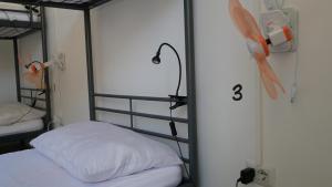 Posteľ alebo postele v izbe v ubytovaní Urban Oasis Hostel