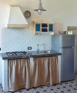 A kitchen or kitchenette at Ulisse Maison de Charme
