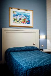 Postel nebo postele na pokoji v ubytování Hotel Palazzo Giancola