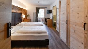 Voodi või voodid majutusasutuse Hotel Brunella toas