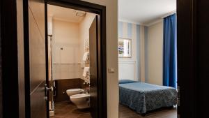 Postel nebo postele na pokoji v ubytování Hotel Palazzo Giancola