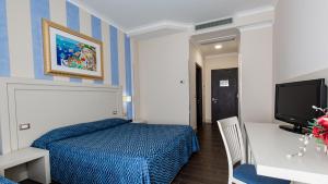 Postel nebo postele na pokoji v ubytování Hotel Palazzo Giancola