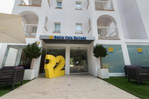 a building with a sign in front of it at R2 Bahia Cala Ratjada - Adults Only in Cala Ratjada