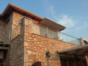 a building with a window on top of it at Villa Lydia in Meganisi