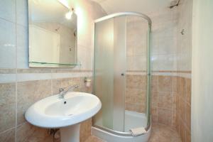 a bathroom with a sink and a shower at Apartmani Bonik in Budva +54 photos