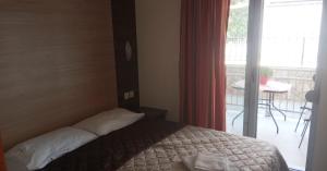 Posteľ alebo postele v izbe v ubytovaní Villa Georgia beach