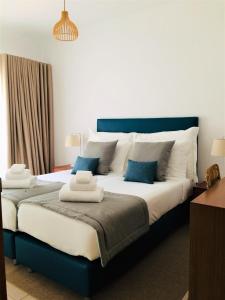 Säng eller sängar i ett rum på Quinta da Encosta Velha