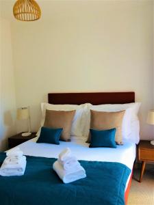 Säng eller sängar i ett rum på Quinta da Encosta Velha