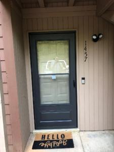 a blue door on the front of a house at Cute Condo in Rock Hill-57 in Rock Hill