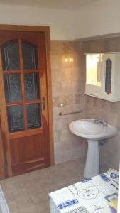 a bathroom with a sink and a mirror at Casa vacanze Mare in Parghelia +6 photos