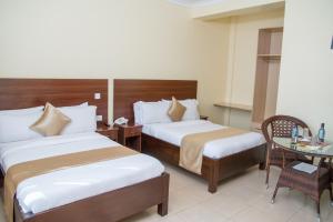 Postel nebo postele na pokoji v ubytování Delfirm Hotel