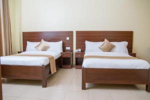 Postel nebo postele na pokoji v ubytování Delfirm Hotel