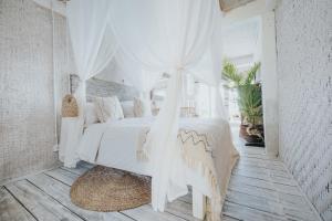 Postel nebo postele na pokoji v ubytování Dreamsea Bali