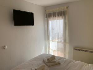 TV a/nebo společenská místnost v ubytování Casa Castillo