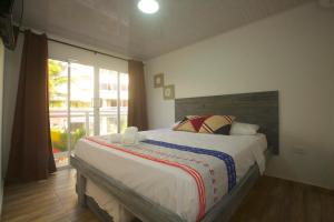 Postel nebo postele na pokoji v ubytování Hotel Nauticus