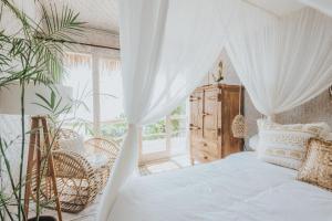 Postel nebo postele na pokoji v ubytování Dreamsea Bali