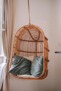 a hanging basket with pillows in a room at Casas do Lago in Estremoz