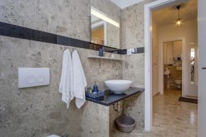 Koupelna v ubytování Apartment Medea, St. Martin