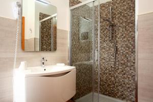 a bathroom with a sink and a shower at Country Villa San Vito Bay in San Vito lo Capo