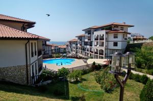 a view of a apartment complex with a swimming pool at ARENA Apart Complex in Sveti Vlas