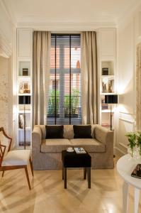 a living room with a couch and a table at Residenza B in Rome