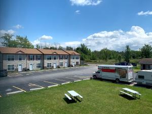 a rv parked in a parking lot next to a building at Stay Vacation Homes Niagara Falls in Niagara Falls