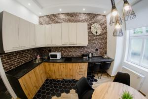 Kuchyň nebo kuchyňský kout v ubytování Apartmani Galea