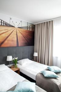 
Łóżko lub łóżka w pokoju w obiekcie Baltic Hotel
