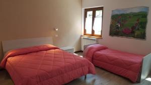 Postel nebo postele na pokoji v ubytování B&B Lo Slittone
