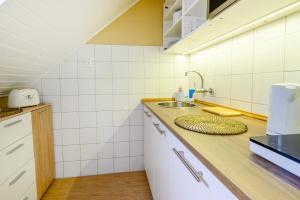 Kuchyňa alebo kuchynka v ubytovaní La Maison du Calme