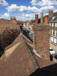 a view from the roof of a building with chimneys at InTown - 60 second walk 2 Minster! in York