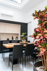 a dining room with a table and chairs at Unique House - Private SPA&Pool -StayInSeville in Seville