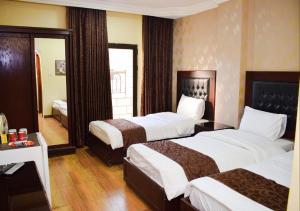 Кровать или кровати в номере Hotel Prestige