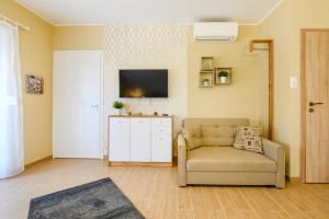 Televízia a/alebo spoločenská miestnosť v ubytovaní La Maison du Calme