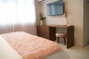 Postel nebo postele na pokoji v ubytování Trópica Beach Hotel