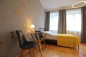 Łóżko lub łóżka w pokoju w obiekcie Apartamenty Mikubo Wrocław