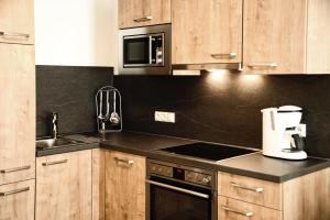 Kuchyň nebo kuchyňský kout v ubytování Appartements Rosenhof