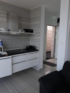 a kitchen with a sink and a counter top at St.Barth Apartments in Šibenik