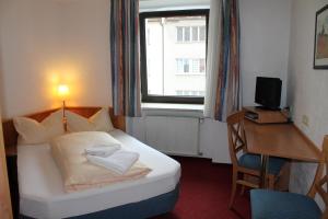 מיטה או מיטות בחדר ב-Hotel Margit