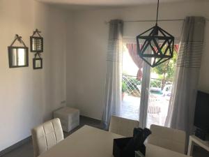Televízia a/alebo spoločenská miestnosť v ubytovaní Villa Lorenta Apartments
