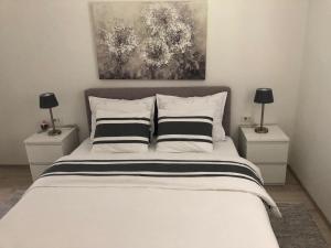 Posteľ alebo postele v izbe v ubytovaní Villa Lorenta Apartments