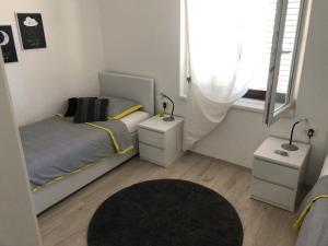 Posteľ alebo postele v izbe v ubytovaní Villa Lorenta Apartments