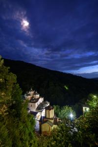 a town in the middle of a valley at night at Hotel Manastir Sv. Joakim Osogovski in Kriva Palanka