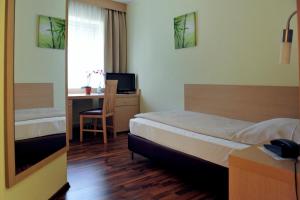 Voodi või voodid majutusasutuse Hotel Tannenhof toas