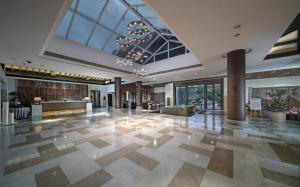 a lobby of a building with a large ceiling at Elite Spring Villas in Anxi