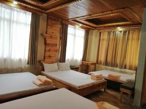 Una cama o camas en una habitación de Sagada Lodging Home